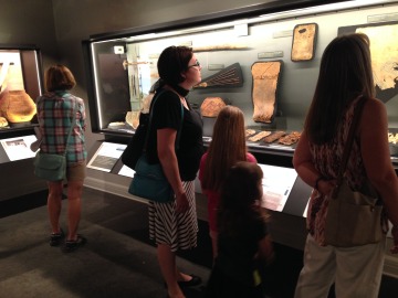 museum patrons looking at an exhibit
