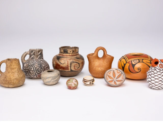 a variety of miniature ceramic vessels