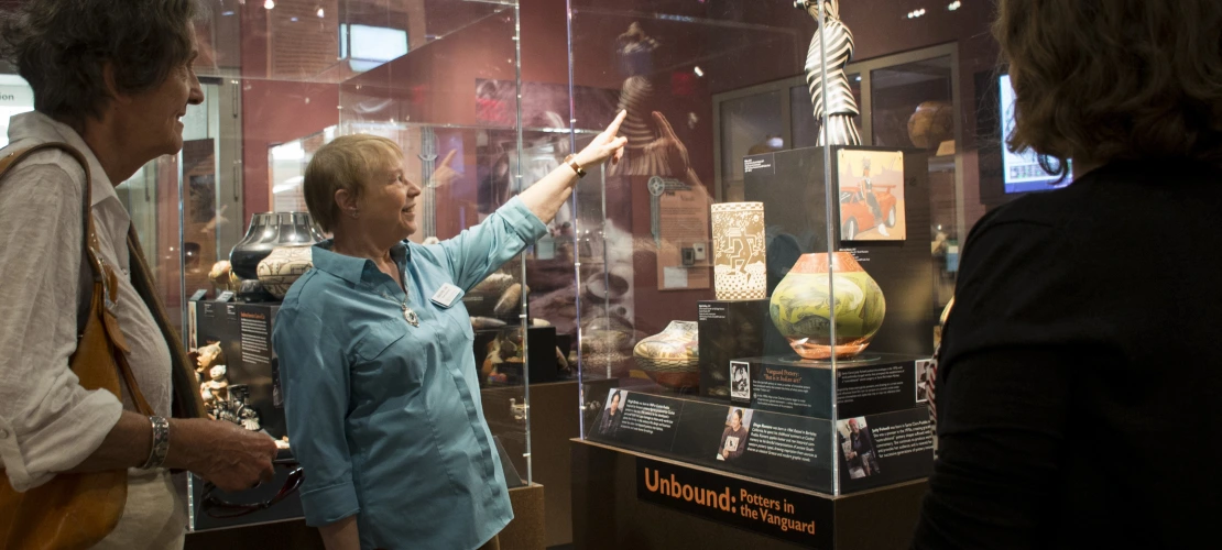 Docents point out important details in the exhibits