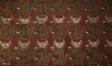 red fabric with pattern of animals